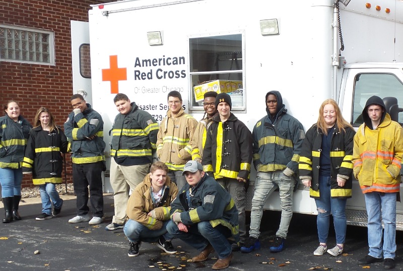 Fire-Rescue-EMR Students standing in front of a Red Cross Truck
